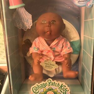 Pink Bath Doll with Cherubic Features and Dark Brown Skin